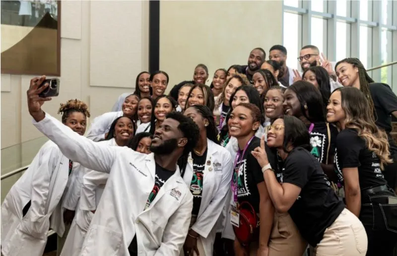 SNDA students taking a group selfie